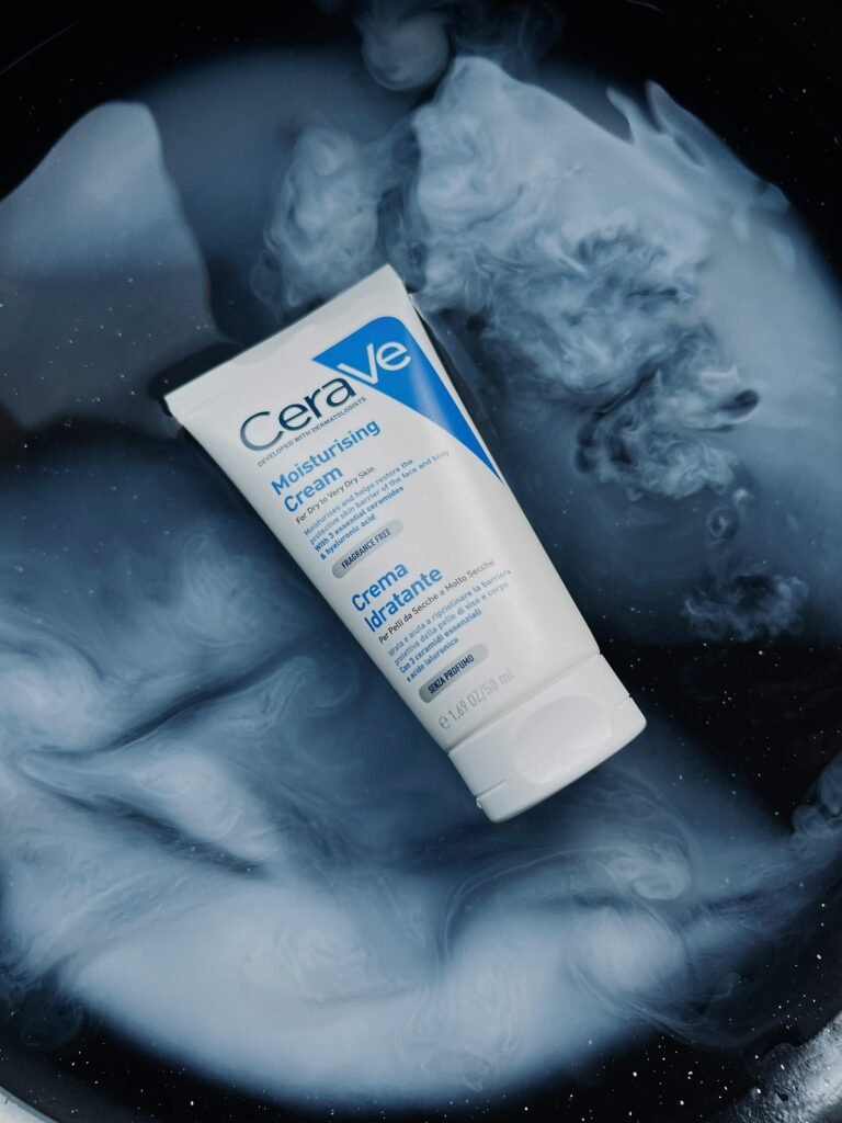 CeraVe Moisturising Cream displayed on a swirling abstract blue and white background.